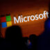 The Microsoft logo is illuminated on a wall during a Microsoft launch event to introduce the new Microsoft Surface laptop and Windows 10 S operating system, on May 2, 2017 in New York City.