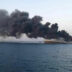 Smoke rises from Iran navy’s largest ship in Jask port in the Gulf, Iran, June 2, 2021. WANA (West Asia News Agency) via REUTERS
