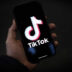 LONDON, ENGLAND - FEBRUARY 28: In this photo illustration, a TikTok logo is displayed on an iPhone on February 28, 2023 in London, England. This week, the US government and European Union's parliament have announced bans on installing the popular social media app on staff devices. (Photo by Dan Kitwood/Getty Images)