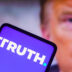 BRAZIL - 2022/09/22: In this photo illustration, the social media platform, Truth Social logo seen displayed on a smartphone with a photo of former US President Donald Trump displayed in the background. (Photo Illustration by Rafael Henrique/SOPA Images/LightRocket via Getty Images)